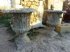 PAIR OF RECONSTITUED STONE MEDICIS STYLE URNS.