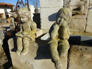  PAIR OF CHILDREN STATUES.